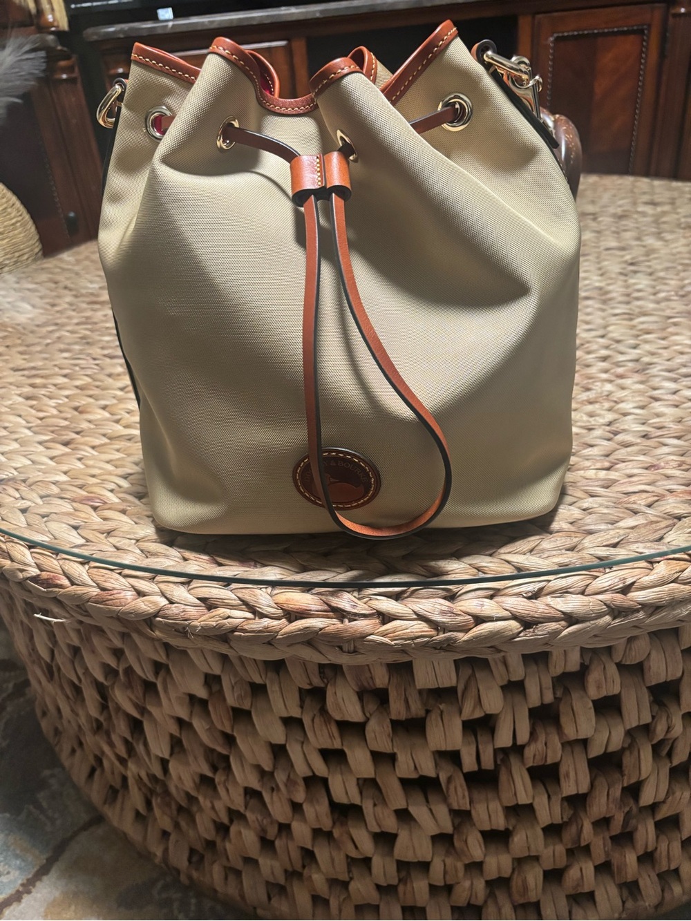 Nylon Dooney and Bourke Drawstring Bucket Bag . In the color khaki.